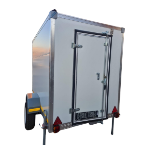 Mobile fridge hire trailer with open doors showcasing spacious interior and adjustable shelving, ideal for events in Johannesburg.